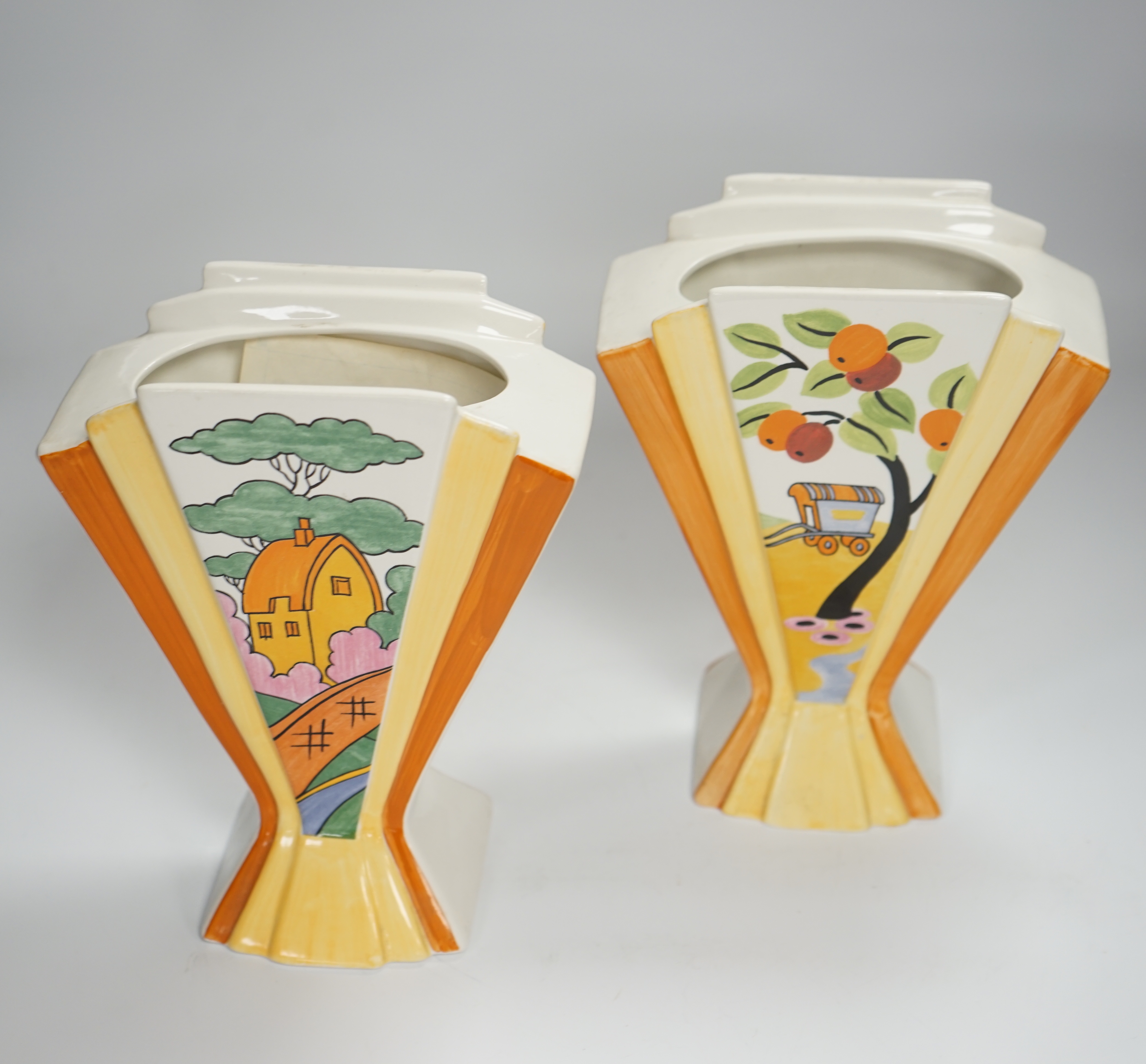 Two modern copies of Clarice Cliff Sunray vases; Caravan and Orange Roof Cottage, 21cm